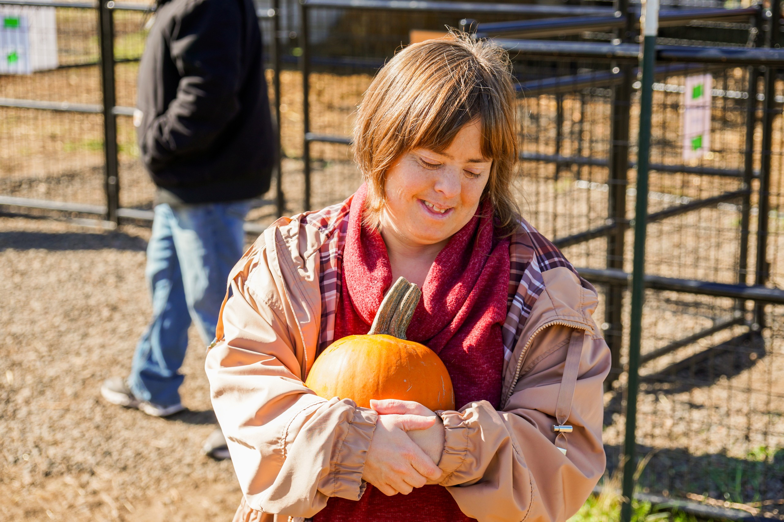 Woman with disabilities holding a pumpkin