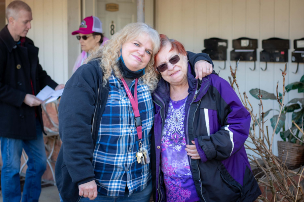 Lori Bacon (right) and Ellen (left) hugging