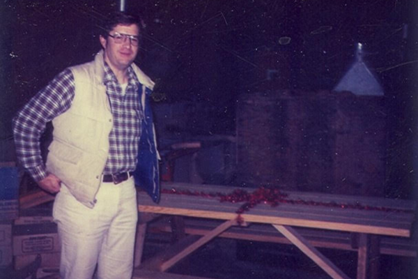Tony Meeker stands next to a donated picnic table.